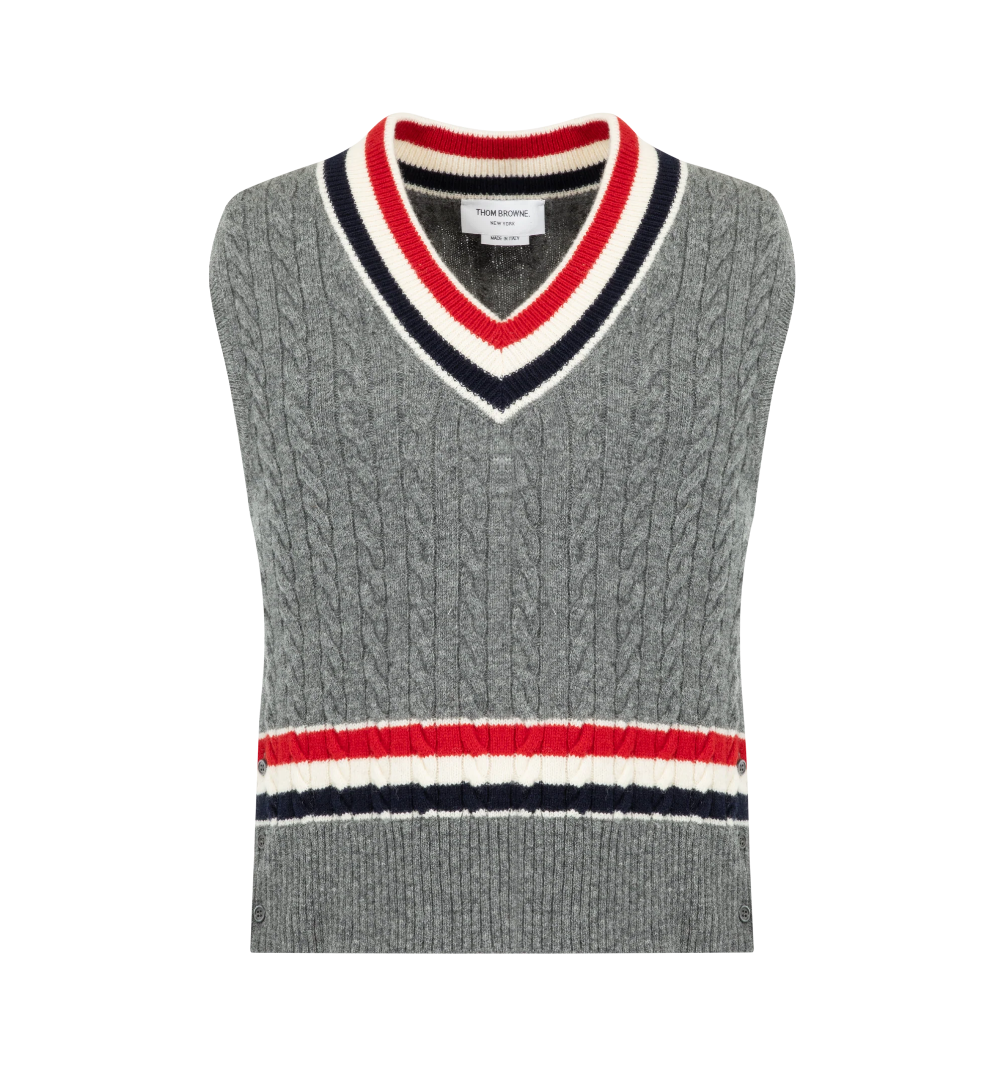 Image 1 of 2 - GREY - Thom Browne Mens Wool V-Neck Vest is crafted from cashmere and features a classic V-neck, signature RWB stripe detailing at the neckline and hem, buttoned side vents, buttoned rib-knit trim with signature striped grosgrain accents, and the signature striped grosgrain loop tab at the back. This designer cashmere sweater vest combines traditional Aran cable knit construction with iconic Thom Browne detailing for elevated everyday layering. Main Material: Wool. Made in Italy.