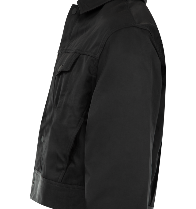 Image 3 of 3 - BLACK - FEAR OF GOD ESSENTIALS Textured Nylon Trucker Jacket featuring a textured nylon, cropped, boxy fit, shirt collar, flap pockets, antique metal hardware and Essentials signature label at the back collar. 100% nylon.