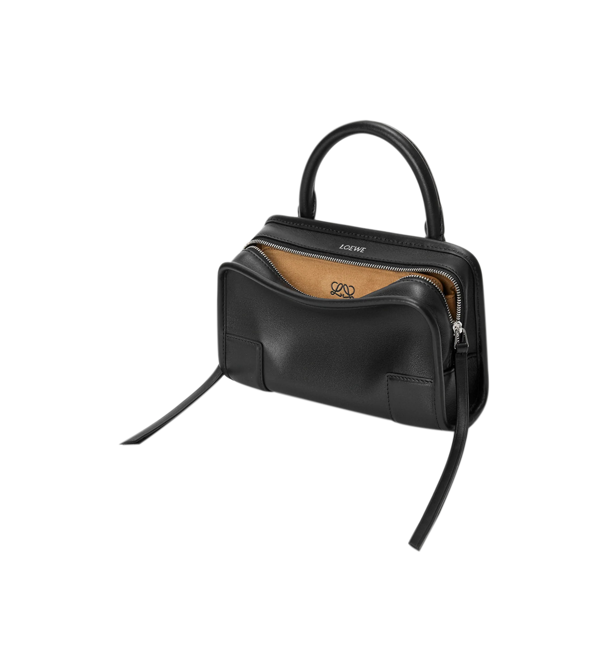 Image 3 of 11 - BLACK - Loewe Mini Amazona 180 Bag in leather features a relaxed silhouette anchored by a single toron top handle, designed to be carried open, while a concealed closure secures the main compartment, removable shoulder and crossbody straps, two carry options: short handle, removable and adjustable crossbody strap, zip closure with two leather zip pullers, two compartments, main compartment closed with magnetic closure, left side d-ring for customization, suede and nappa lambskin lining, and  