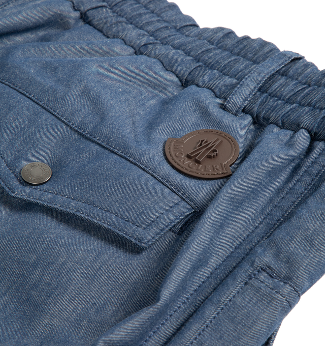 Image 3 of 3 - BLUE - MONCLER Trousers featuring button zip closure, straight leg, elastic waist, side pockets and back flap pockets with snap buttons.