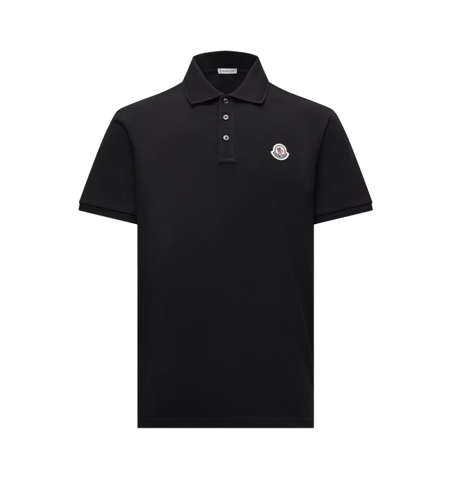 Image 1 of 1 - BLACK - Moncler Mens Cotton Polo Shirt is crafted from cotton piqu. Features a regular fit, ribbed collar with mother-of-pearl button closure, short sleeves, and signature logo patch. Main Material: 100% Cotton; Ribbed Cuffs: 99% Cotton, 1% Elastane/Spandex; Ribbed Collar: 99% Cotton, 1% Elastane/Spandex. Made in Turkey.