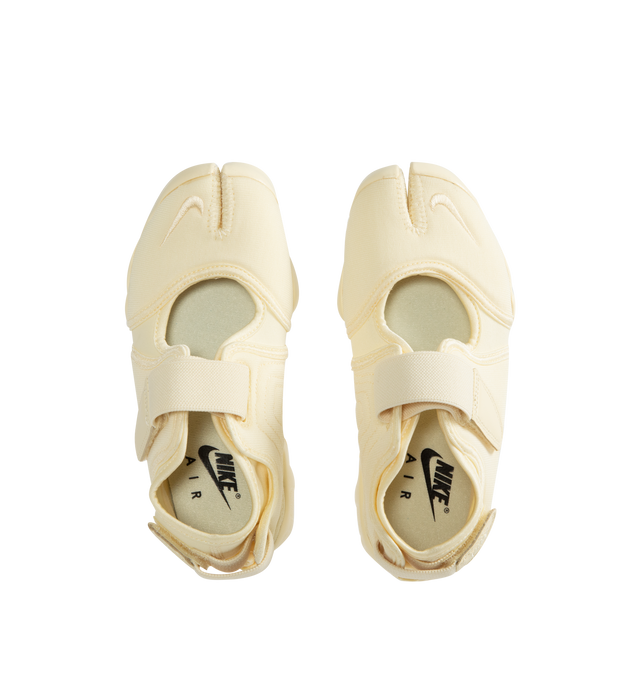 Image 5 of 5 - WHITE - NIKE Air Rift Sneaker featuring hook-and-loop straps on the midfoot and heel, Nike Air unit in the heel combined with plush foam, rubber detailing on the outsole, upper features a blend of elastane, polyester and nylon materials for a flexible fit and split toe design.
