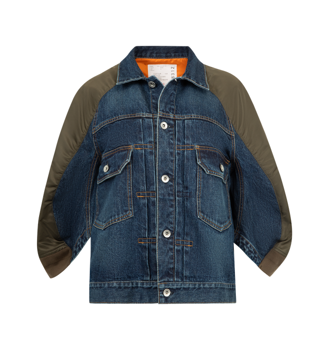 Image 1 of 3 - BLUE - SACAI Denim Nylon Mixed Media Jacket featuring an indigo-dyed denim front contrasted by puffer-inspired nylon back paneling, front button closure, spread collar, three-quarter sleeves, chest button-flap patch pockets and sleeve zip pocket. 100% cotton. 100% nylon, 55% polyester, 44% cotton, 1% polyurethane. Made in Japan.