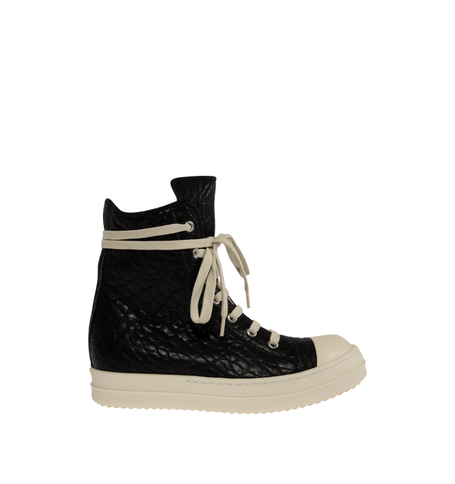 Image 1 of 5 - BLACK - Rick Owens Womens High-Top Sneakers are crafted from textured leather. Feature an above-ankle silhouette, seven-eyelet lace-up closure, inner ankle zip, calf leather toe cap, and signature shark-tooth thermoplastic rubber outsole. Upper: 100%Leather; Toe: 100% Calf Leather; Lining: 100% Calf Leather; Insole: 100% Calf Leather; Outsole: 100% Thermoplastic Rubber. Sole Height: 3.5 cm. Made in Italy.
