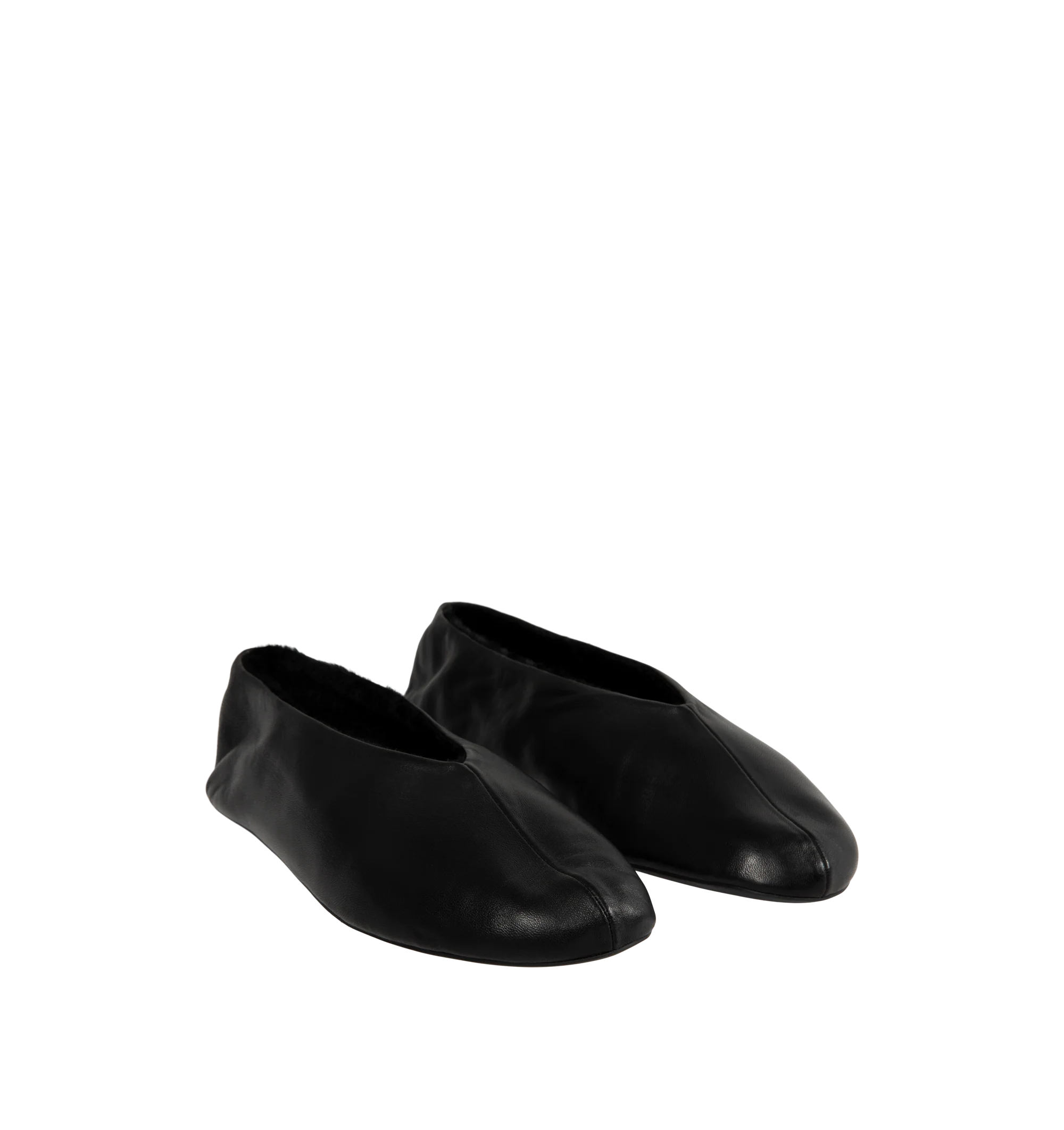 Image 2 of 4 - BLACK - The Row Women's Stella Slippers are crafted from smooth nappa lambskin leather and feature a slip-on silhouette with an oval toe, soft shearling lining, and a flexible rubber-coated sole. These designer leather slippers combine exceptional Italian craftsmanship with luxurious comfort, making them an elevated choice for effortless everyday wear. Main Material: 100% Lambskin Leather. Lining: Shearling. Sole: Rubber-Coated. Made in Italy. 