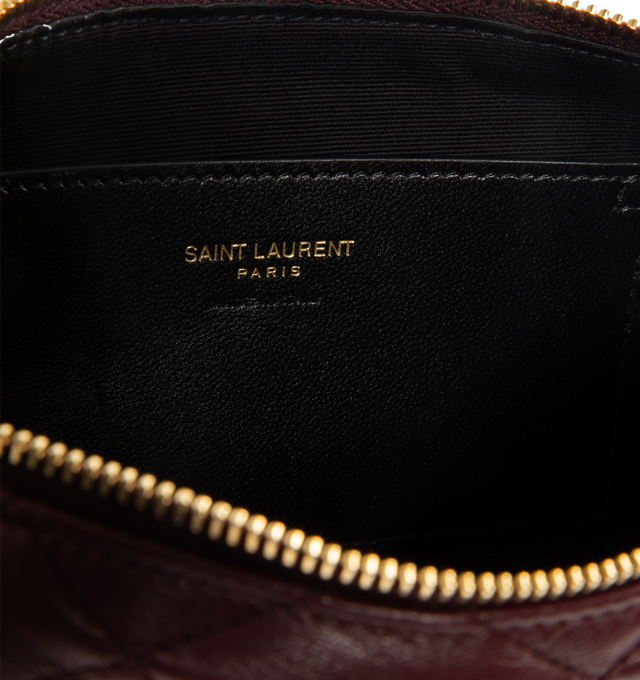 Image 2 of 2 - RED - SAINT LAURENT Bijou Pouch in lambskin featuring a CASSANDRE jewelry chain wrist strap, diamond quilting, cotton lining, bronze-tone hardware, one flat pocket and zip closure. 7.1" x 3.5" x 1.6". Handle drop: 6.7". Lambskin. Made in Italy.