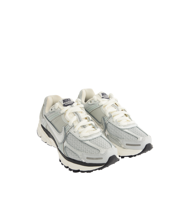Image 2 of 5 - GREY - NIKE Zoom Vomero 5 Sneaker featuring real and synthetic leather on the upper, mesh panels and ventilation ports on the heel, Zoom Air cushioning, plastic caging on the side, rubber outsole and reflective details.