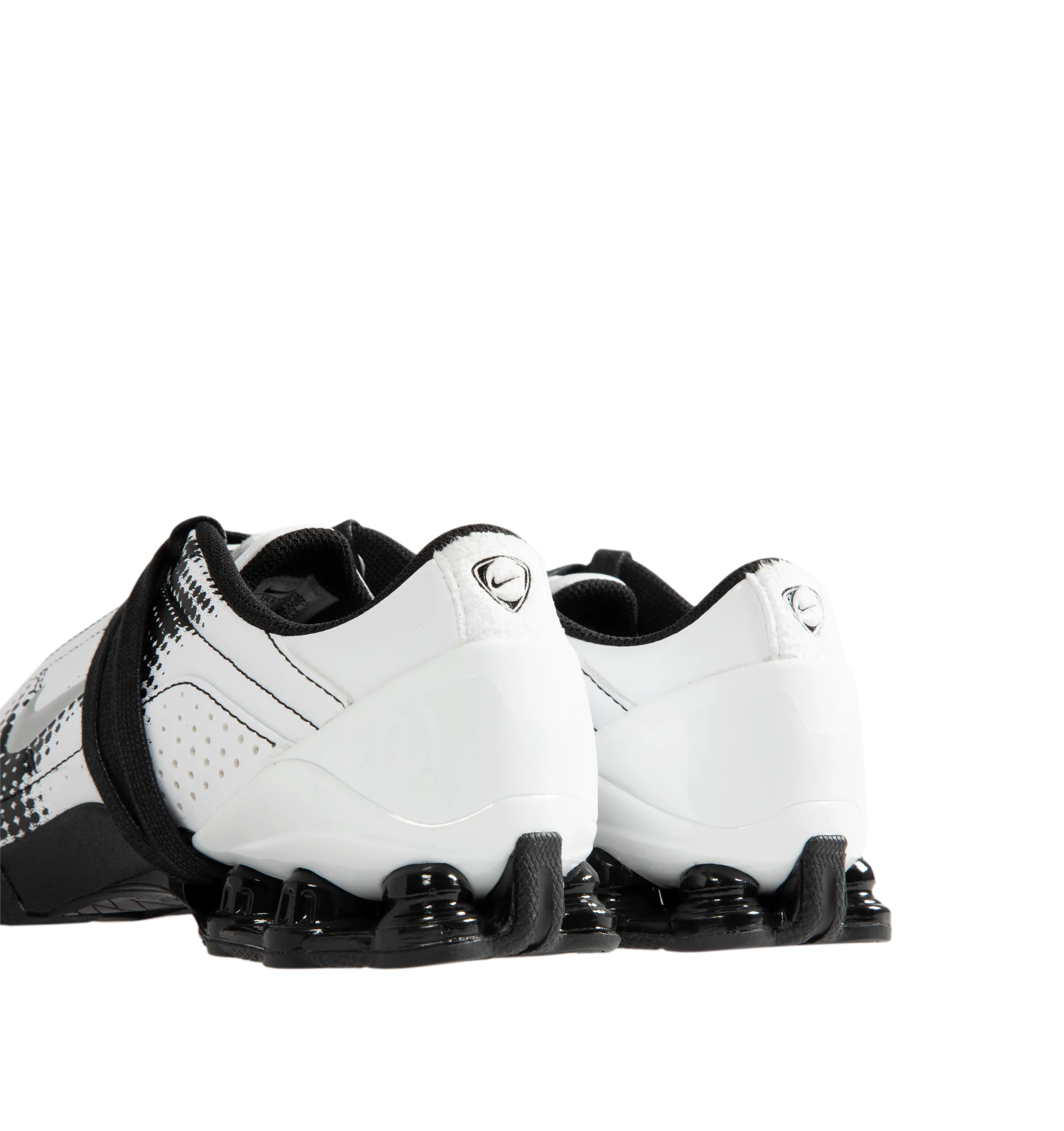 Image 3 of 5 - WHITE - Nike Women's Total 90 Shox Magia Sneakers feature a premium nubuck leather upper with oversized laces and printed graphic detailing, combining the iconic design of the Total 90 with a sleek, tonal finish. Inspired by early-2000s soccer style, these lifestyle sneakers pair signature Nike Shox cushioning with a durable rubber outsole for responsive comfort and everyday wear. Main Material: Nubuck Leather. Midsole: Nike Shox. Sole: Rubber.  