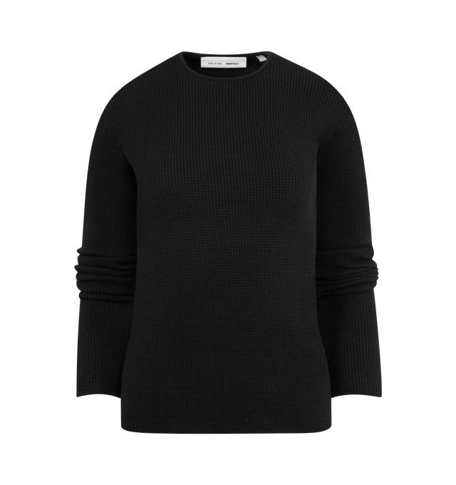 Image 1 of 2 - BLACK - FEAR OF GOD ESSENTIALS Waffle Long Sleeve Top featuring a poly-nylon waffle knit, form-fitting silhouette, rib-knit crewneck and a Fear of God Essentials label positioned at the back. 88% polyester, 12% nylon waffle knit.