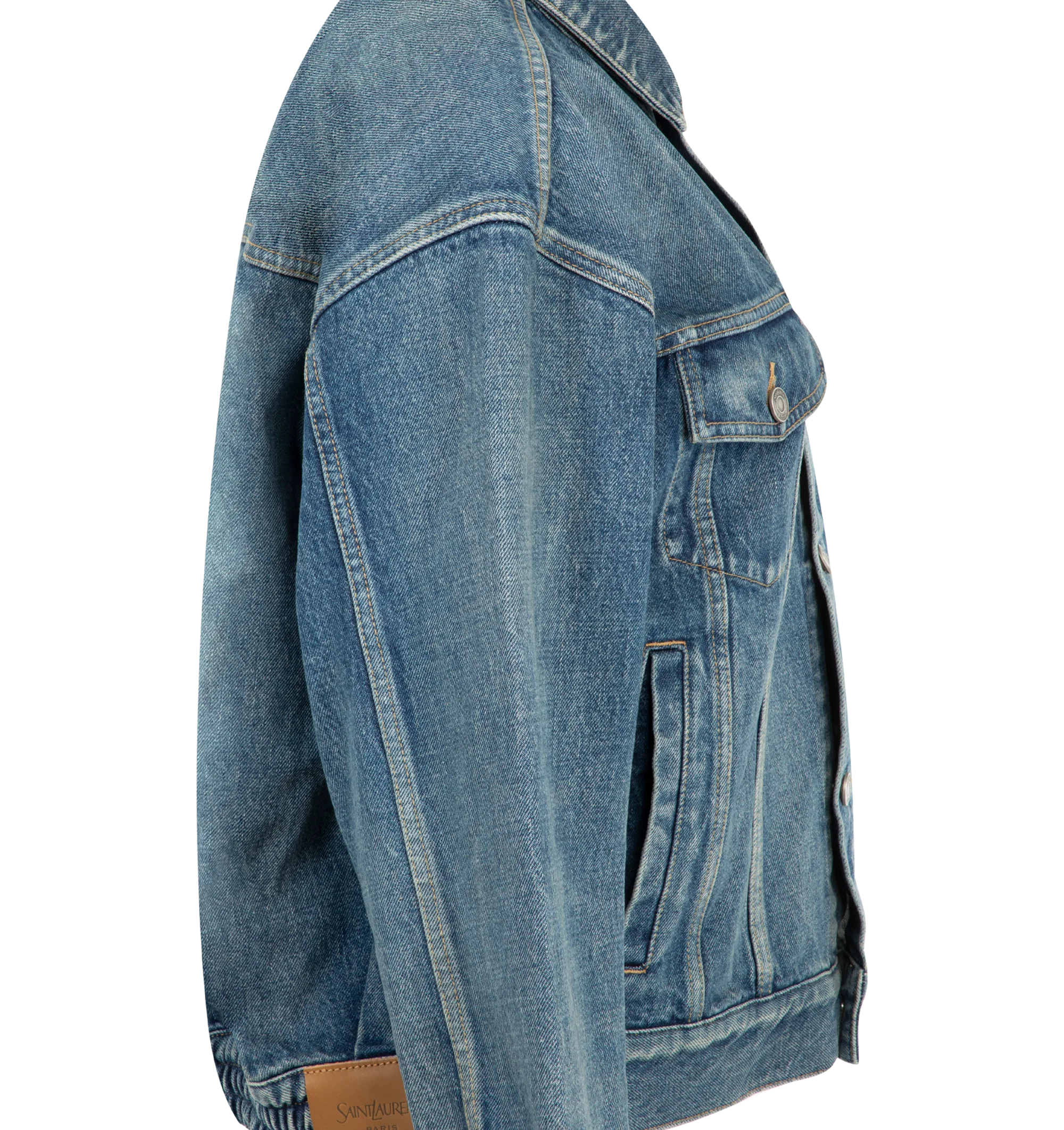 Image 3 of 3 - BLUE - Saint Laurent Womens Jean Jacket is crafted from certified cotton denim. Features a loose fit, button-front closure, pointed collar, buttoned flap chest pockets, front welt pockets, one-button cuffs, cotton lining, and embossed Saint Laurent Paris leather jacron. Main Material: 100% Cotton; Lining: Cotton. Made in Japan. 