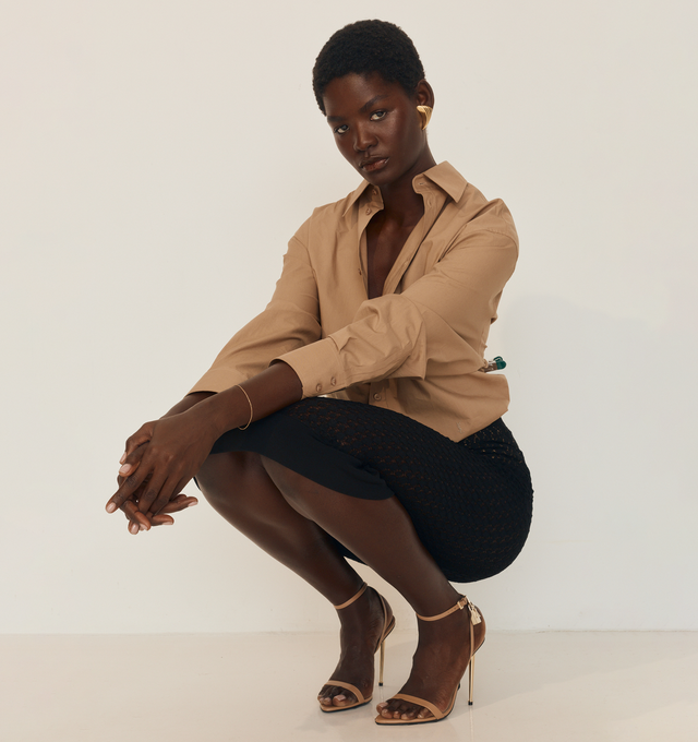 Image 2 of 4 - BROWN - SAINT LAURENT Buttoned Shirt made with certified cotton featuring a pointed collar, chest pocket with logo embroidery, front button closure and one-button mitered cuffs. 100% cotton. Made in Italy.