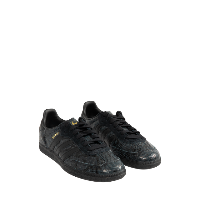 Image 2 of 5 - BLACK - Adidas Men's Samba OG Snake-Effect Sneakers are crafted from calf leather. Features a snake-effect finish, round toe, lace-up closure, signature 3-Stripes, logo-print tongue, branded heel counter, and flat rubber sole. Upper: Calf Leather; Lining: Calf Leather; Sole: Rubber. Made in Cambodia.