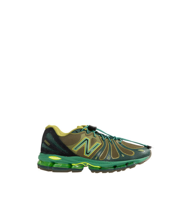 Image 1 of 5 - GREEN - New Balance 1890 Mens Sneakers feature a synthetic upper with a classic lace-up silhouette. Designed with ABZORB midsole cushioning for enhanced impact absorption, all-day comfort, and a durable rubber outsole. Upper: Synthetic; Midsole: ABZORB. Made in Vietnam.