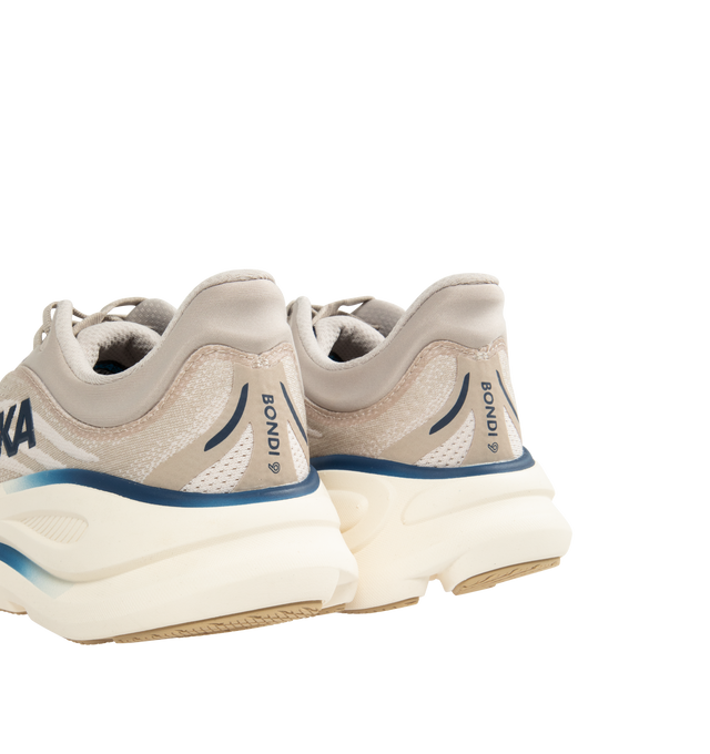 Image 3 of 5 - NEUTRAL - HOKA M Bondi 9 Sneaker featuring engineered mesh upper with rubber sole, lace-up front, foamed EVA midsole and increased stack height for maximum cushioning, zonal breathability, reflective detailing and cushioned tongue and collar.