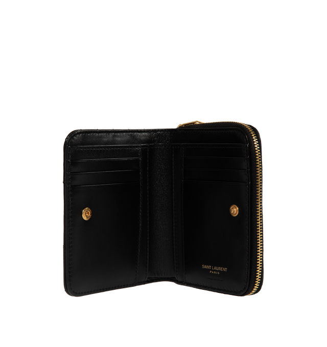 Image 2 of 2 - BLACK - SAINT LAURENT Compact Zip Around Wallet featuring gold tone hardware, six card slots, one zipped coin pocket, one bill compartment and four receipt compartments. 4.7 X 3.9 X 1.1 inches. 85% lambskin, 15% brass. Made in Italy.
