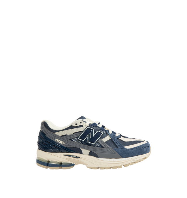Image 1 of 5 - NAVY - NEW BALANCE 1906 Utility Sneaker featuring a cushioned midsole, breathable mesh upper and supportive construction, stability web outsole technology and lace-up closure.